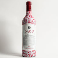 Thumbnail for DAOU Wine Bundle - DAOU bottle wrap on a wine bottle (view 6)
