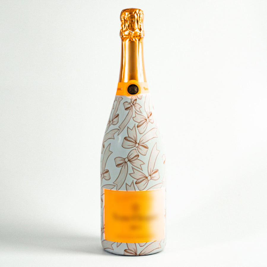 Beige Bows Bottle Wrap on Champagne Bottle