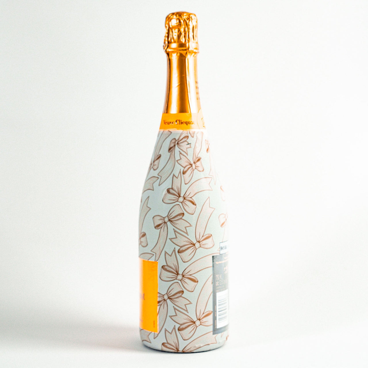 Beige Bows Bottle Wrap on Champagne Bottle