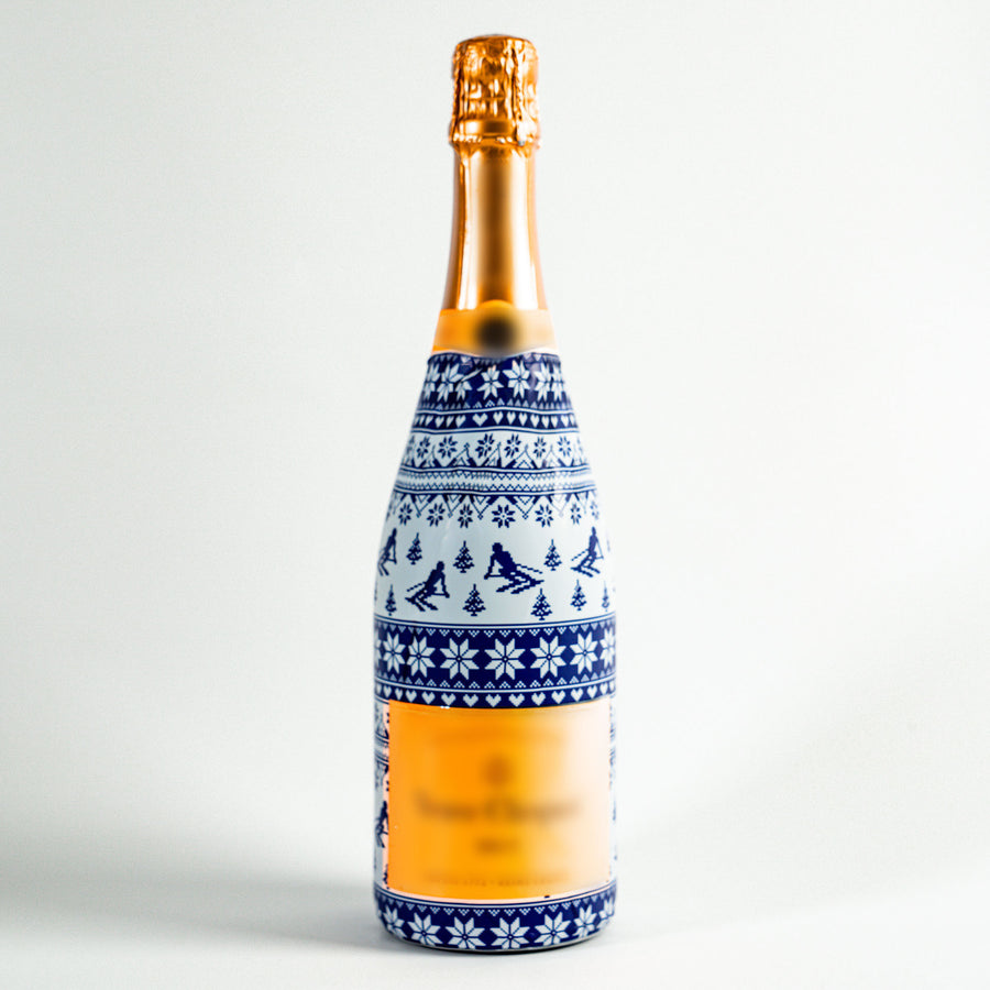 Blue and White Knitted Ski Bottle Wrap on Champagne Bottle