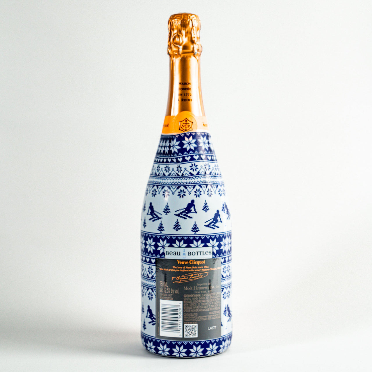 Blue and White Knitted Ski Bottle Wrap on Champagne Bottle