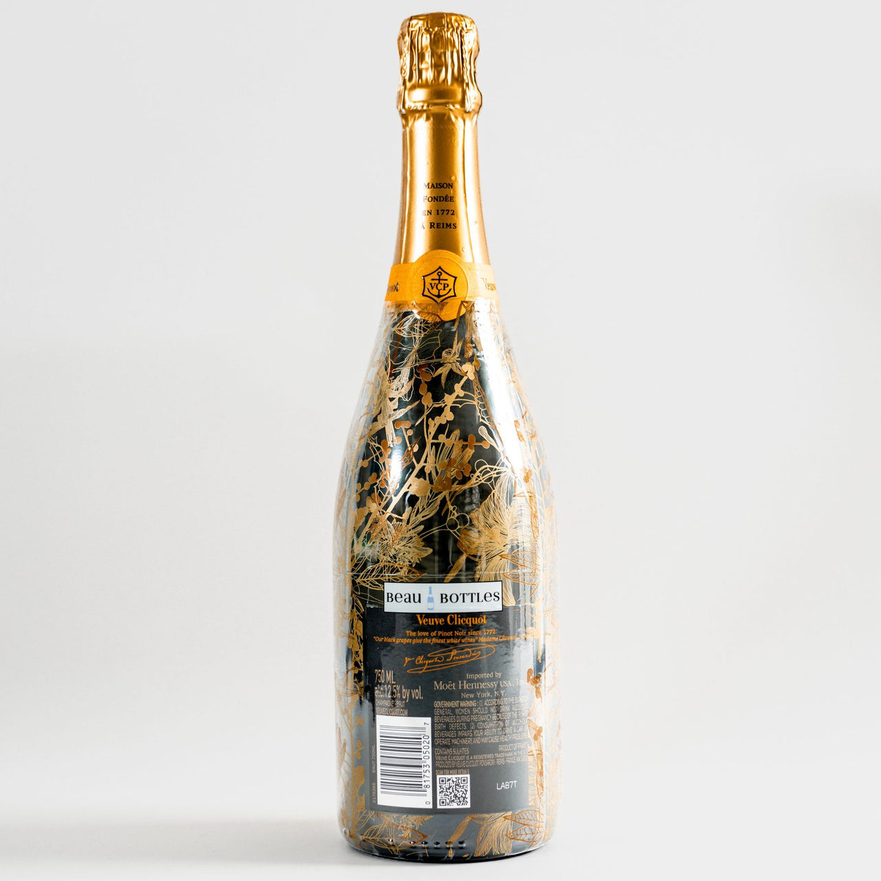 Clear Golden Botanical Bottle Wrap on Champagne Bottle