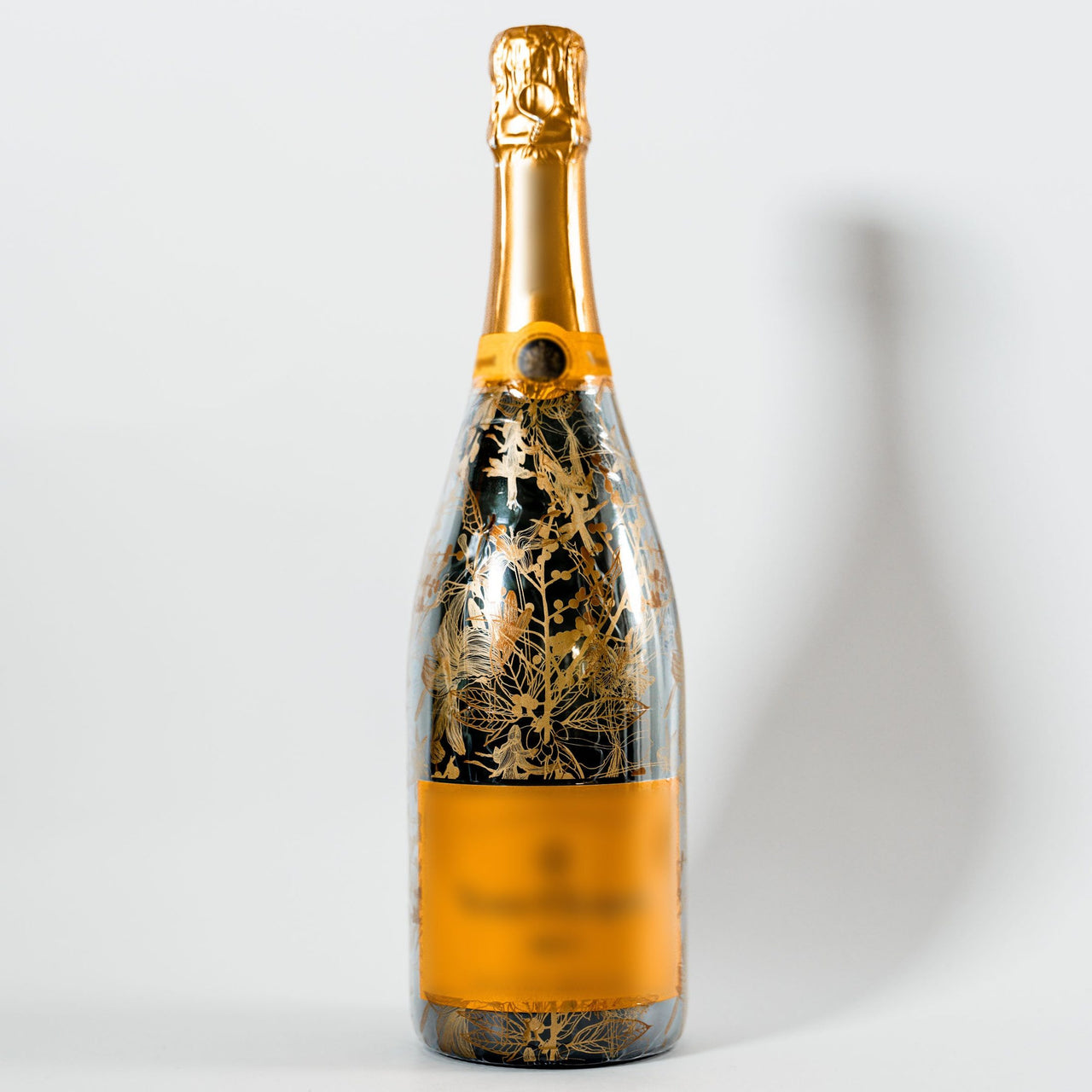 Clear Golden Botanical Bottle Wrap on Champagne Bottle