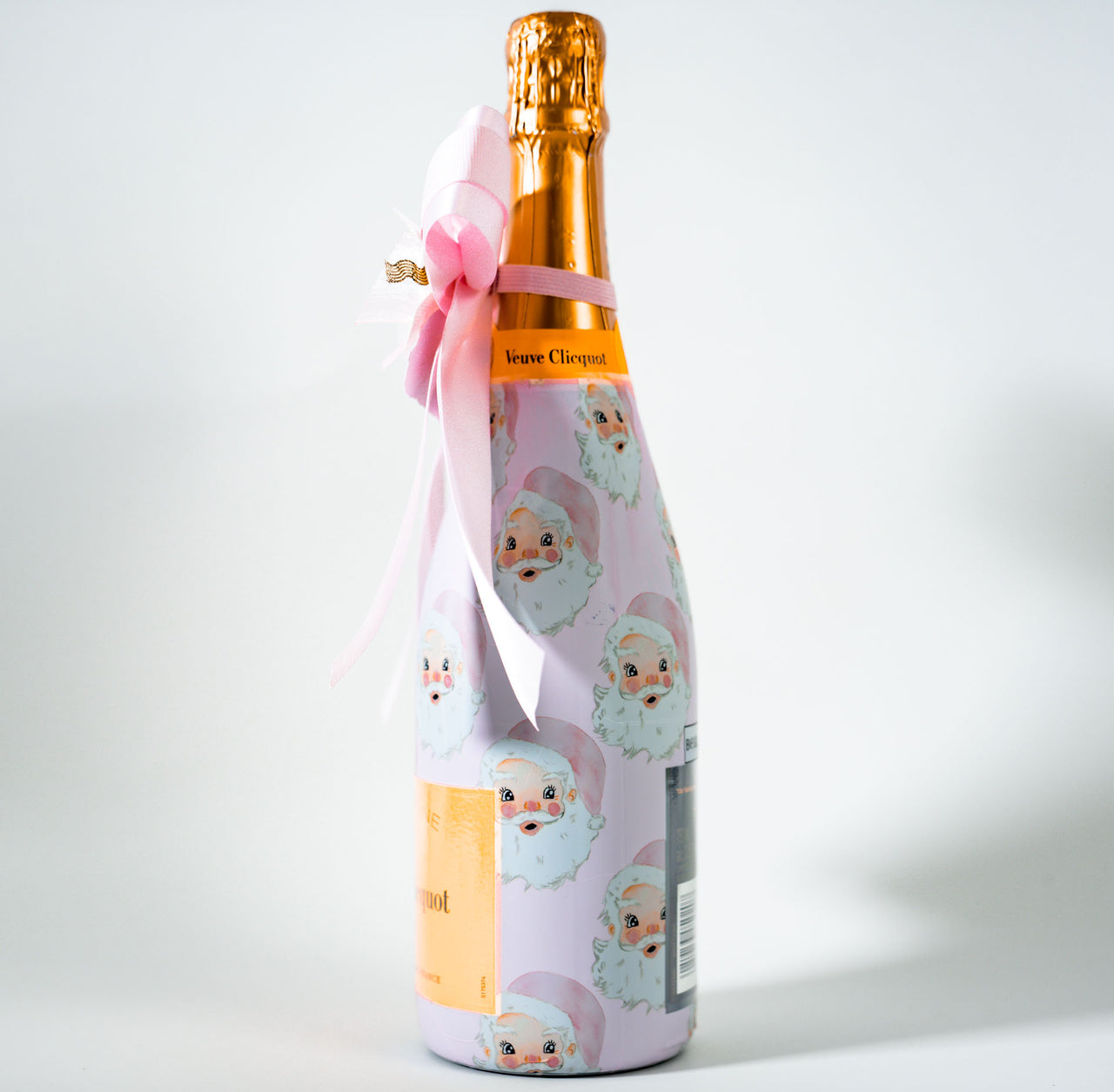 Wrapido Watercolor Pink Santa Bottle Wrap & Bougie Bow Matching Set on Champagne Bottle